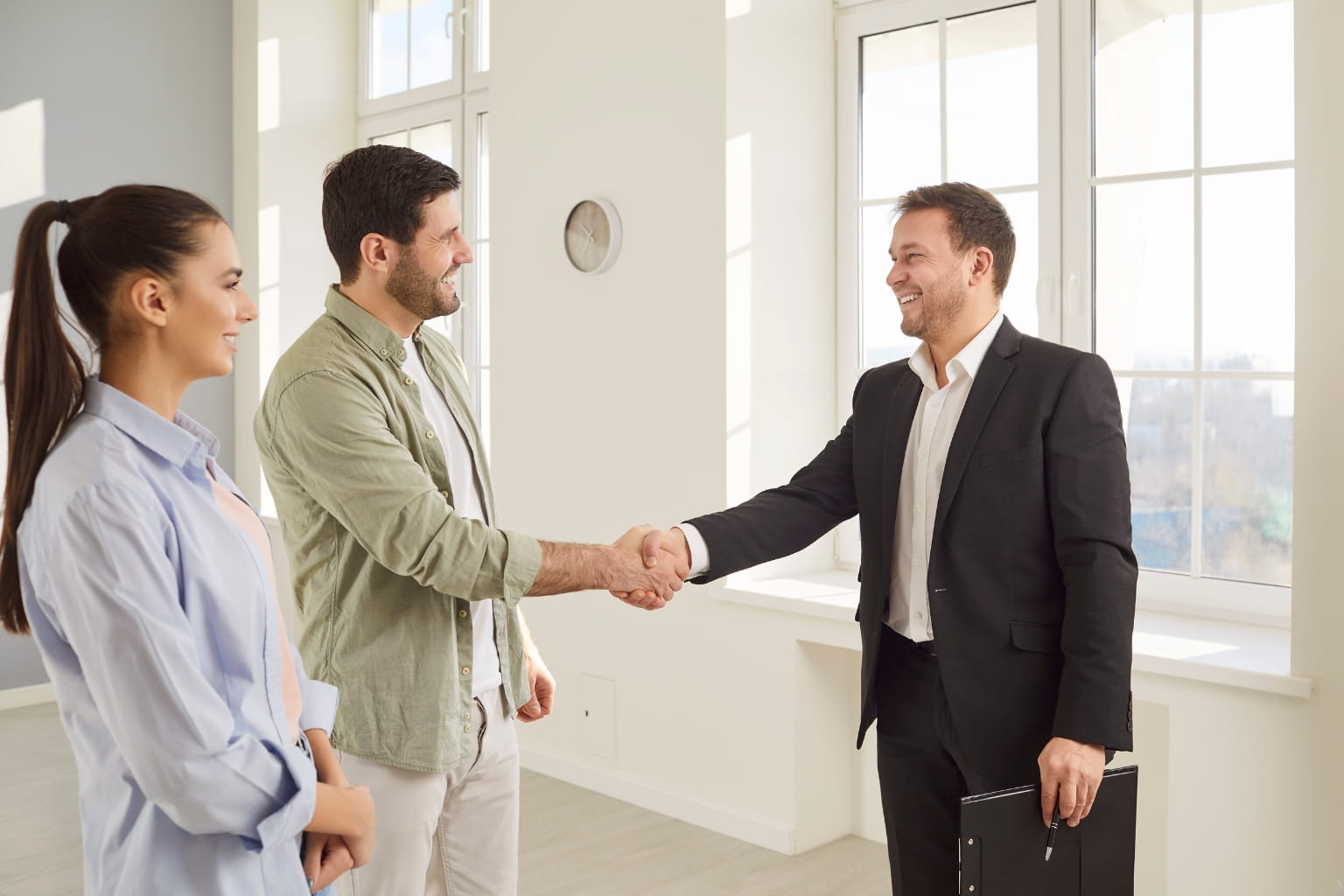 Danville Schools and Real Estate: couple meeting with a real estate agent