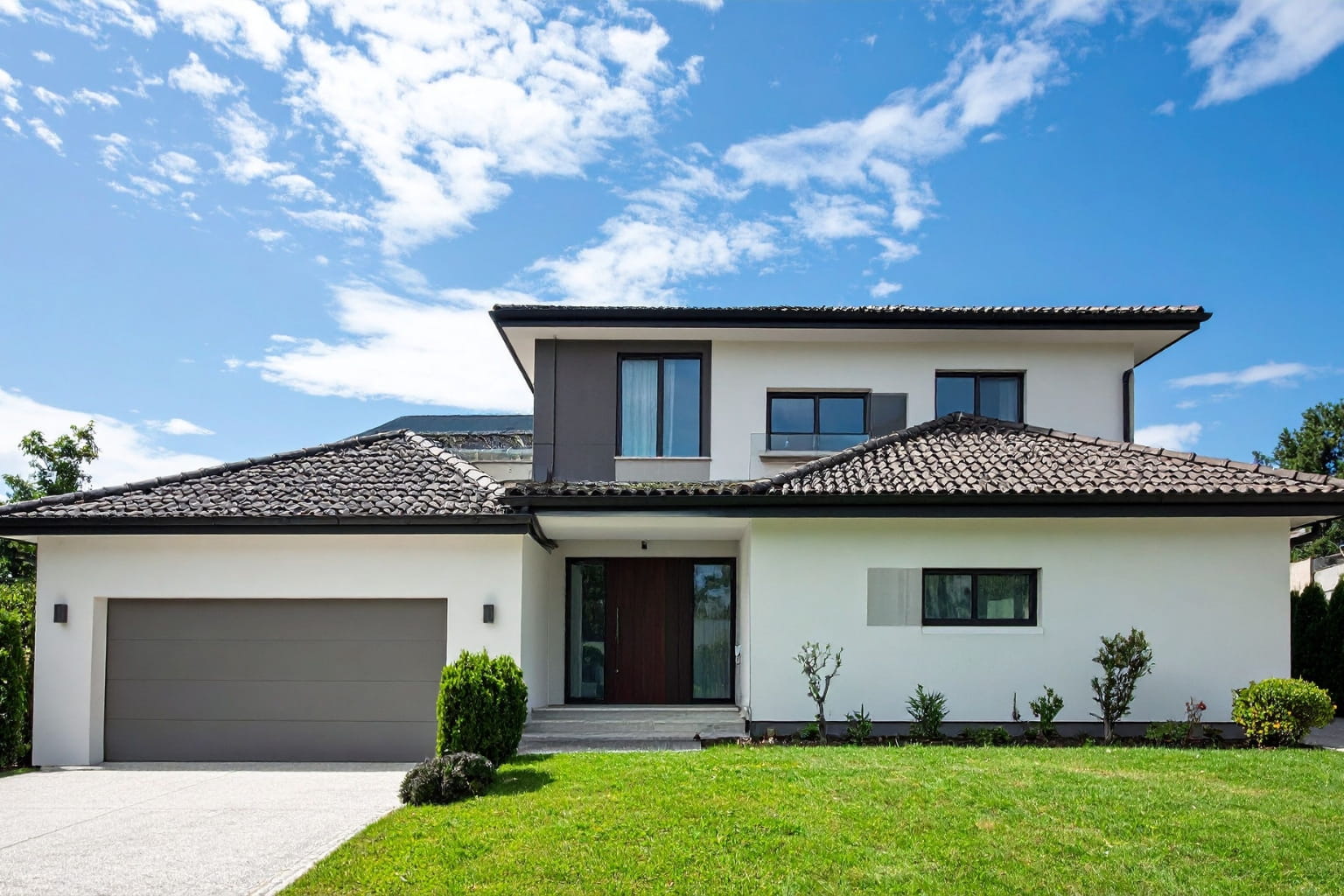 home with sunlight shining on the front yard