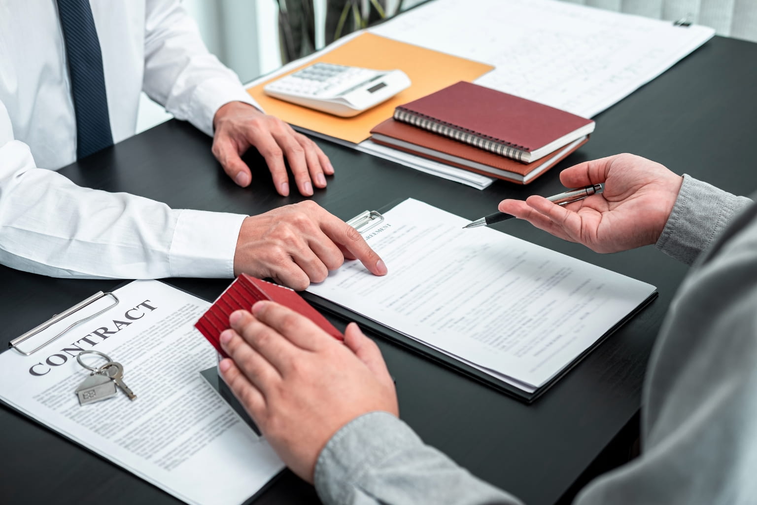 Home Selling Timeline in Moraga Close-up of hands signing real estate documents