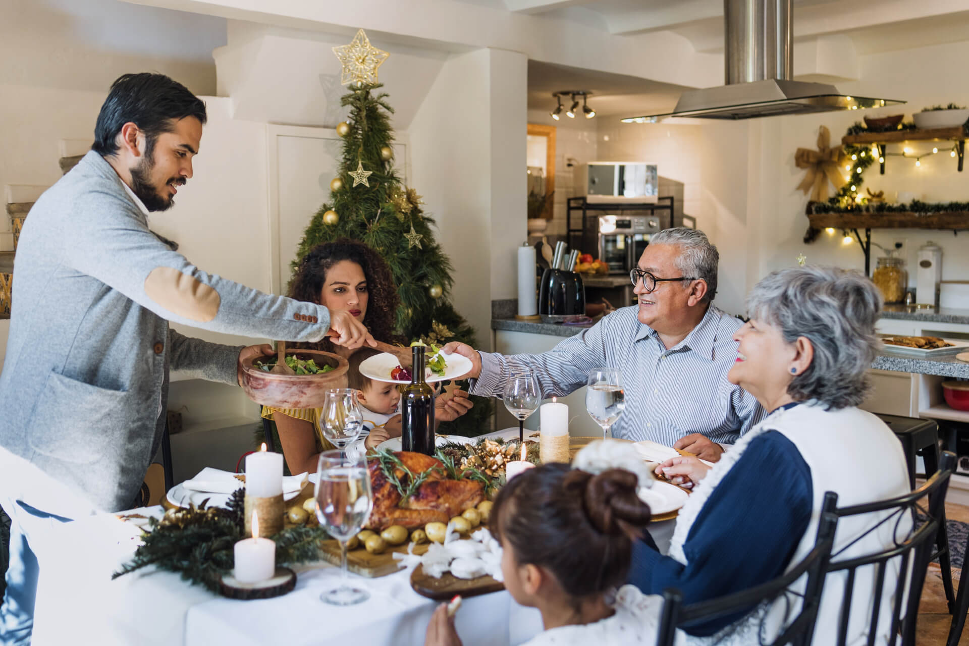 Latin family having Christmas dinner at home
