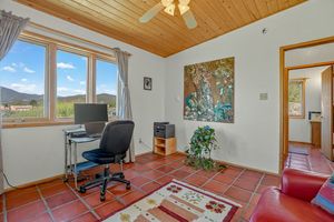 Studio office space with desk and artwork at 1417 Santa Cruz Road, Taos, NM