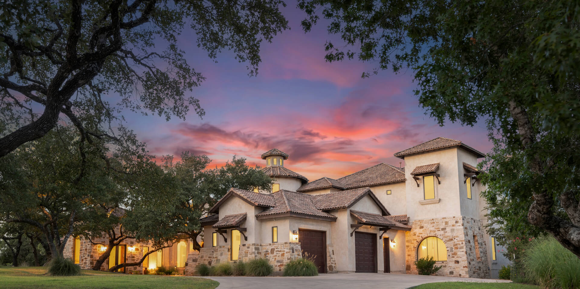 Beautiful sunset over a modern home surrounded by nature