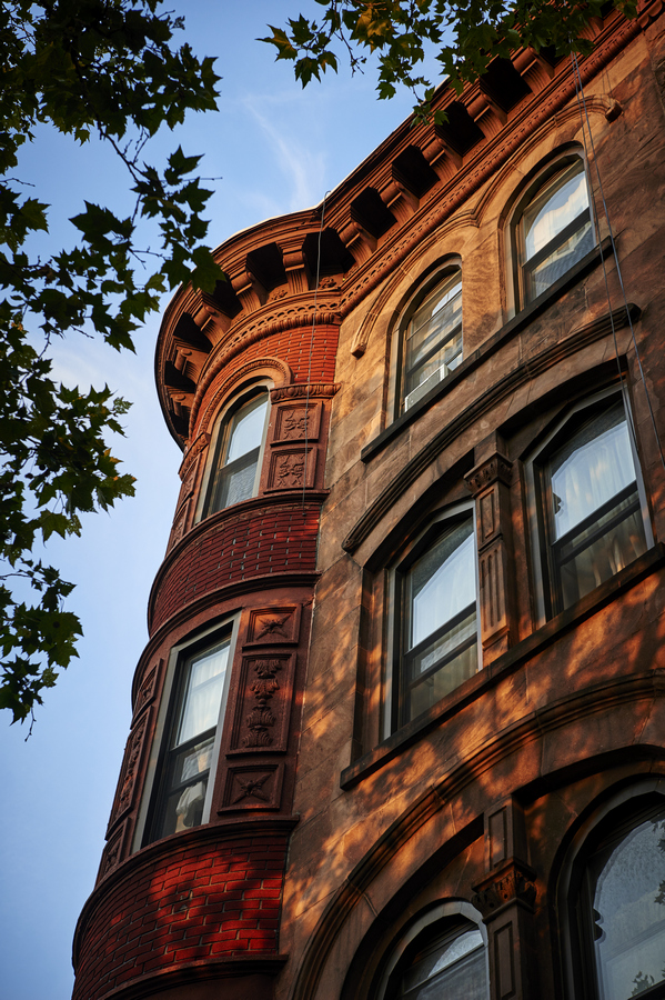 Looking,Up,At,The,Corner,Of,A,Brownstone,Building