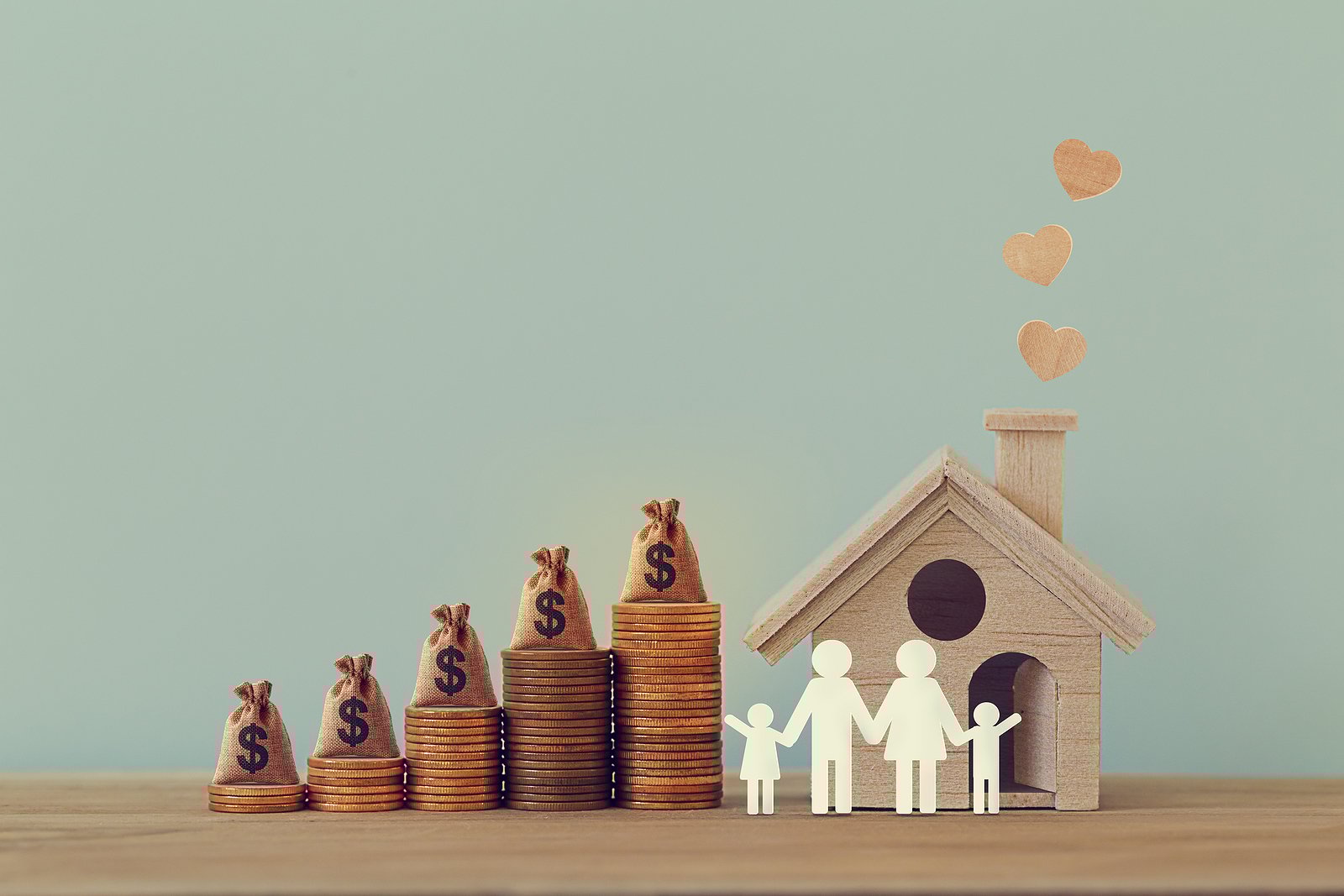 Mini House And Heart, Family Members, Us Money Bags On Rows Of R