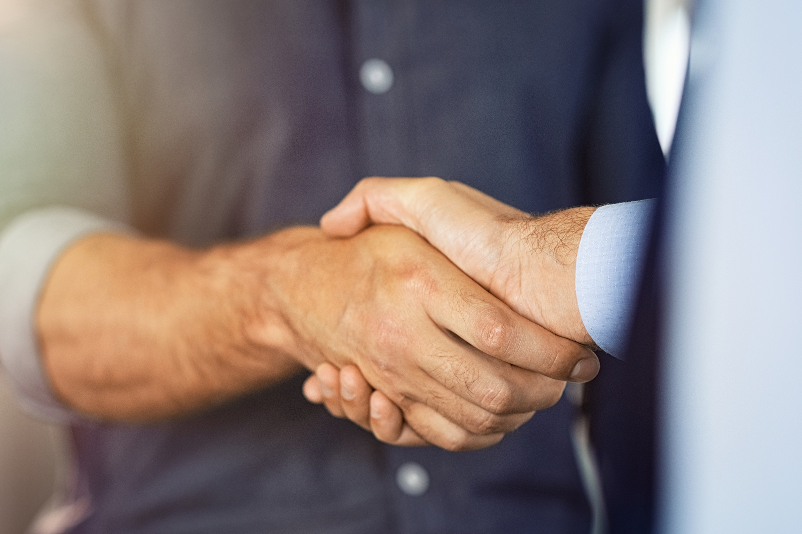 Close up of friendly handshake of business people. Business part