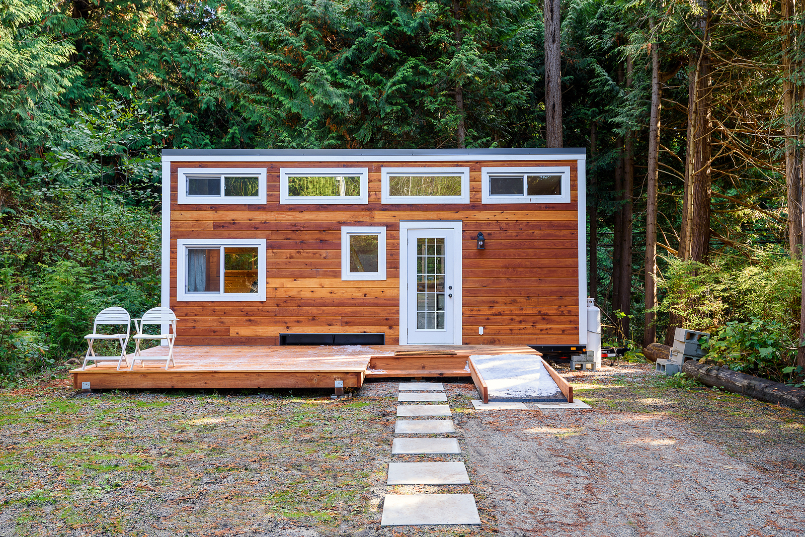 Small wooden rustic cabin house. Exterior design.