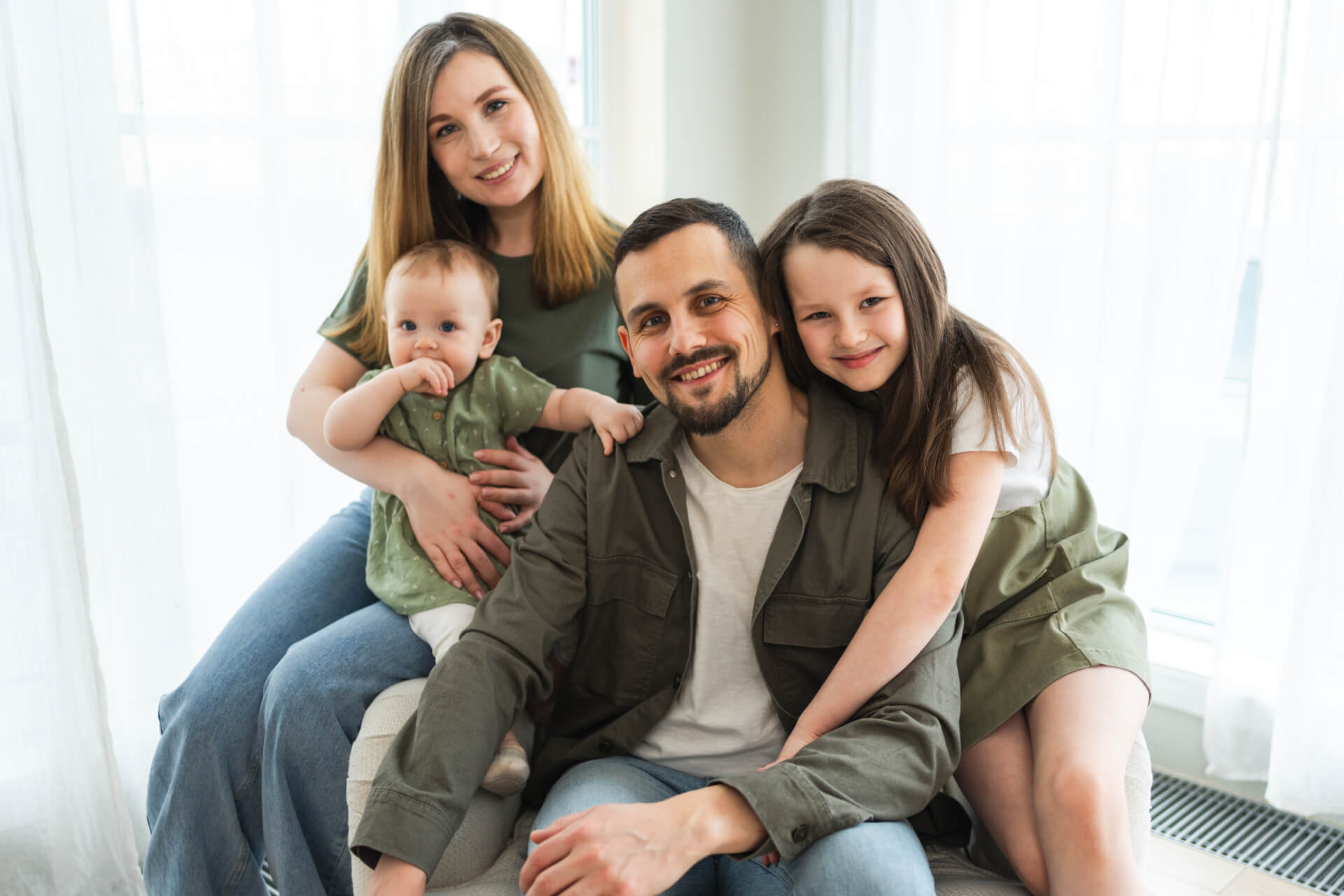 Happy family at home. Mother father two children