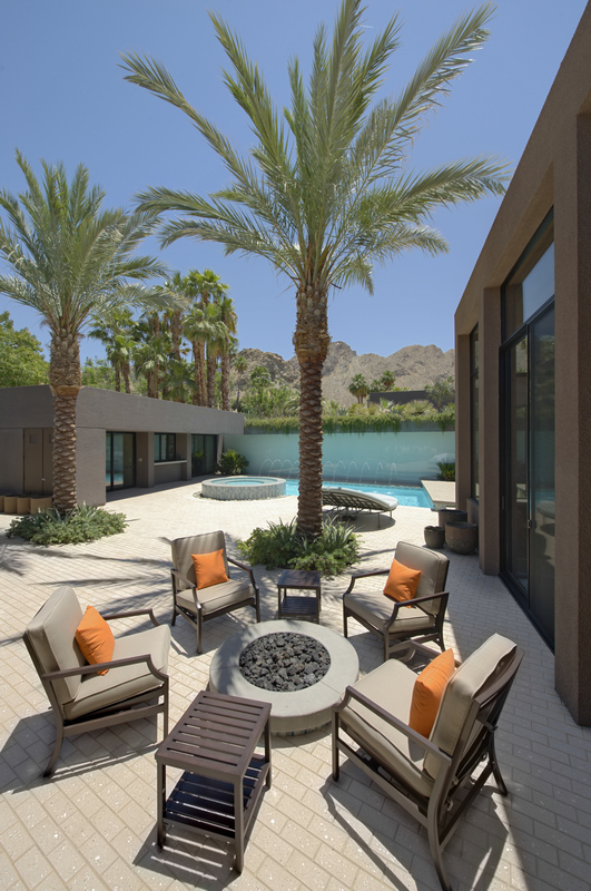 Fire,Pit,Surrounded,By,Chairs,Of,Californian,Home