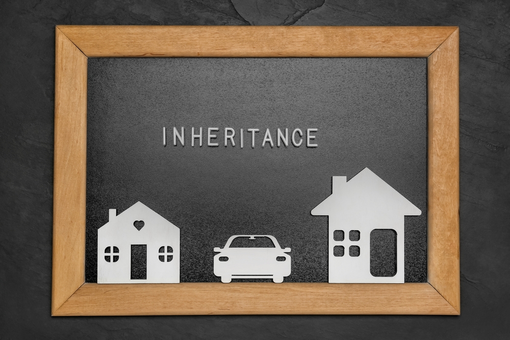 Board,With,Word,Inheritance,And,Different,Cutouts,On,Black,Background,