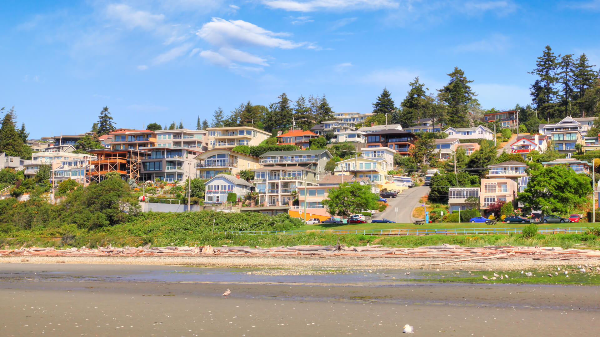 Low tide on the sandy beach at the popular quaint seaside community of White Rock surrounding Semiahmoo Bay near Vancouver in British Columbia, Canada