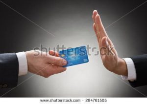 stock-photo-close-up-of-a-businessman-s-hand-avoiding-credit-card-284761505