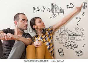 stock-photo-closeup-portrait-of-adult-couple-sitting-on-floor-at-their-apartment-and-planning-renovation-of-107762792