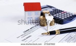 stock-photo-fountain-pen-and-key-and-calculator-and-paper-house-and-coins-stack-on-loan-application-form-for-273187802