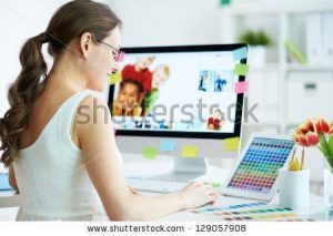 stock-photo-portrait-of-pretty-female-designer-working-with-colors-at-home-129057908