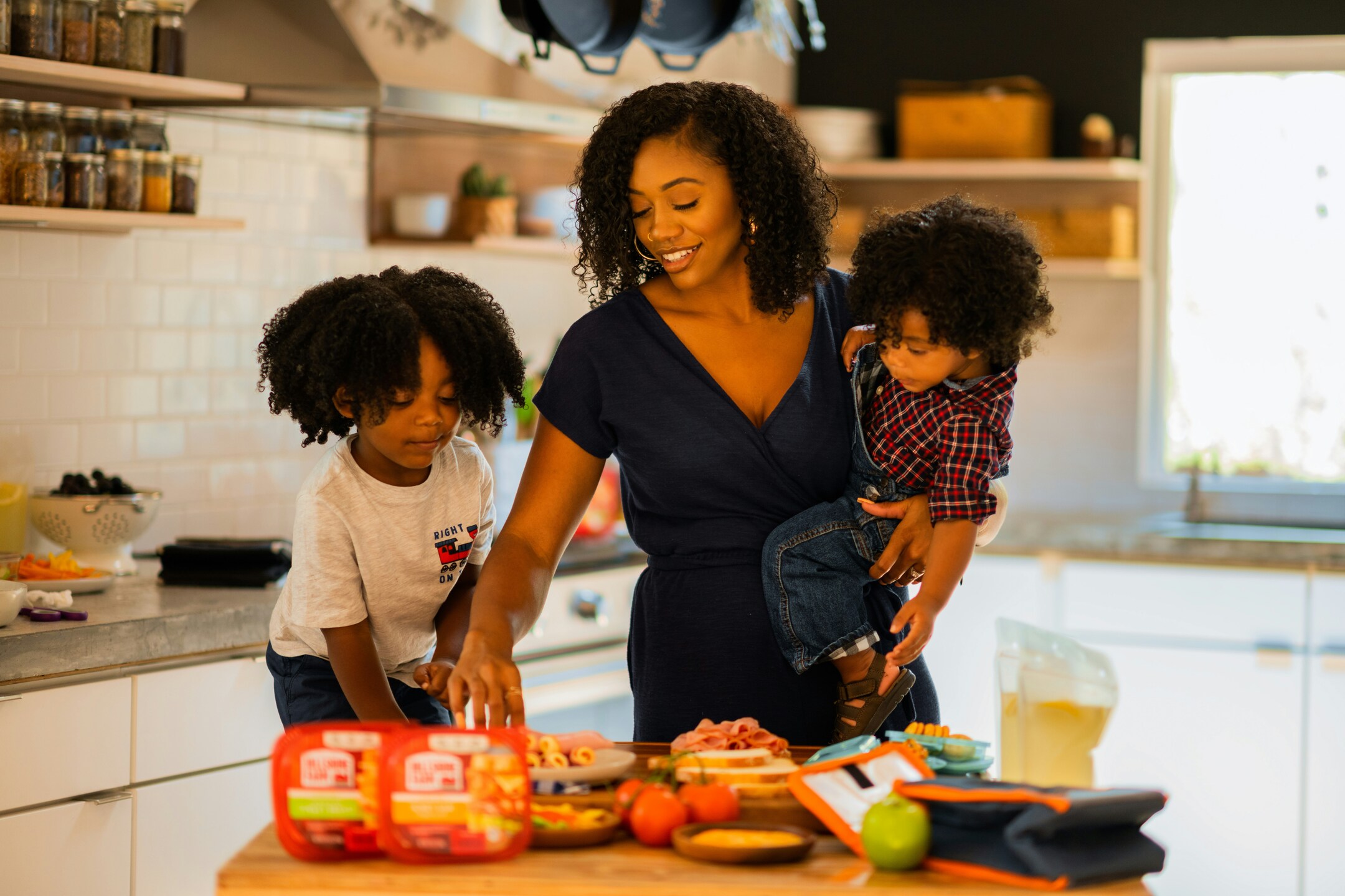 happy-mom-with-two-children-in-a-kitchen