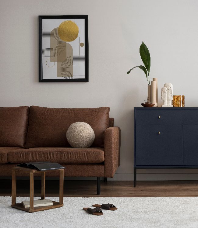Interior design of harmonized living room with brown sofa, blue commode(1)