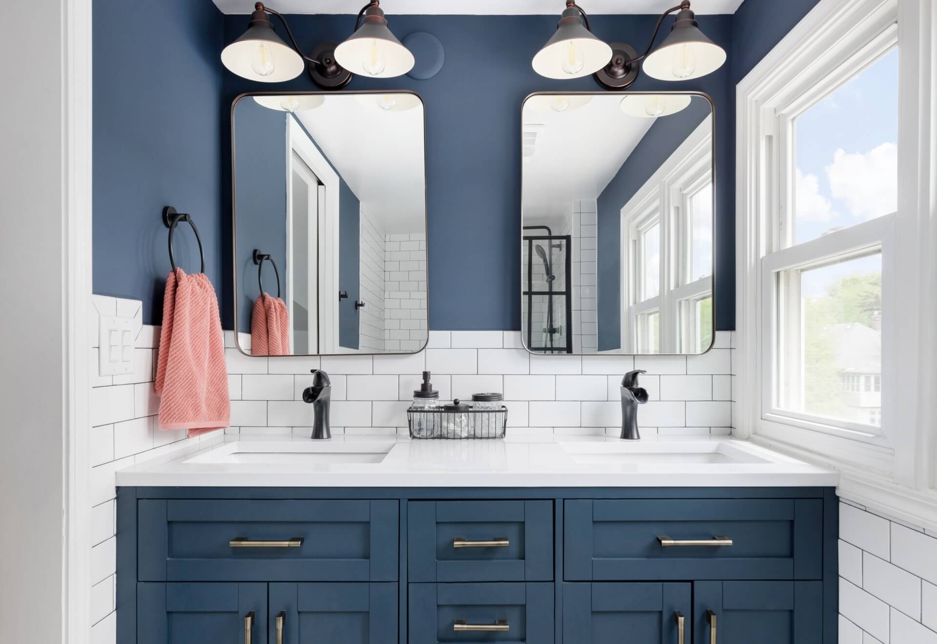 Dark Blue Bathroom with Double Vanity, Modern Mirrors, and White Subway - Copy