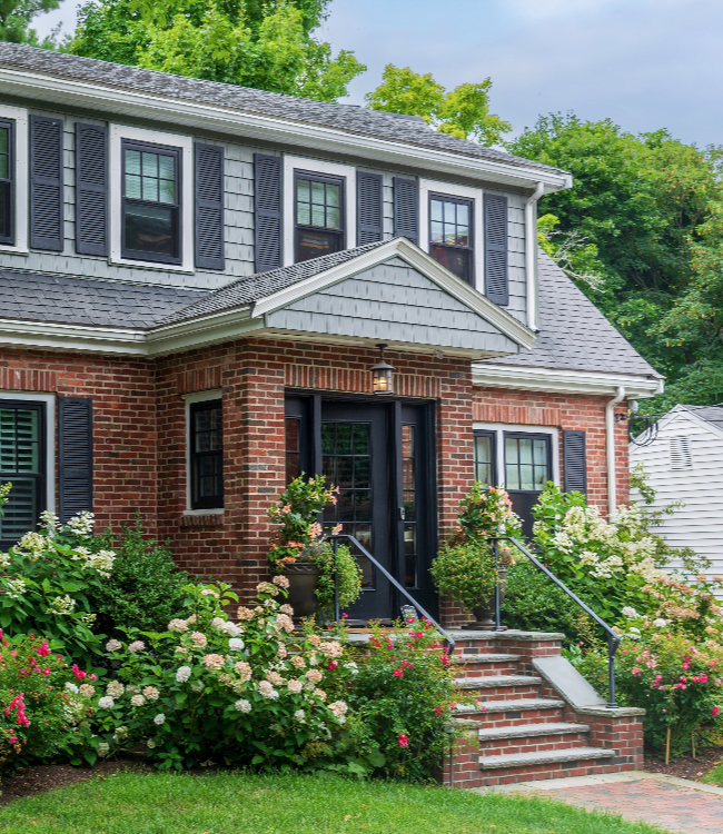 Charming Classic Family House Surrounded by Beautiful Blooming Flowers and Trees.1