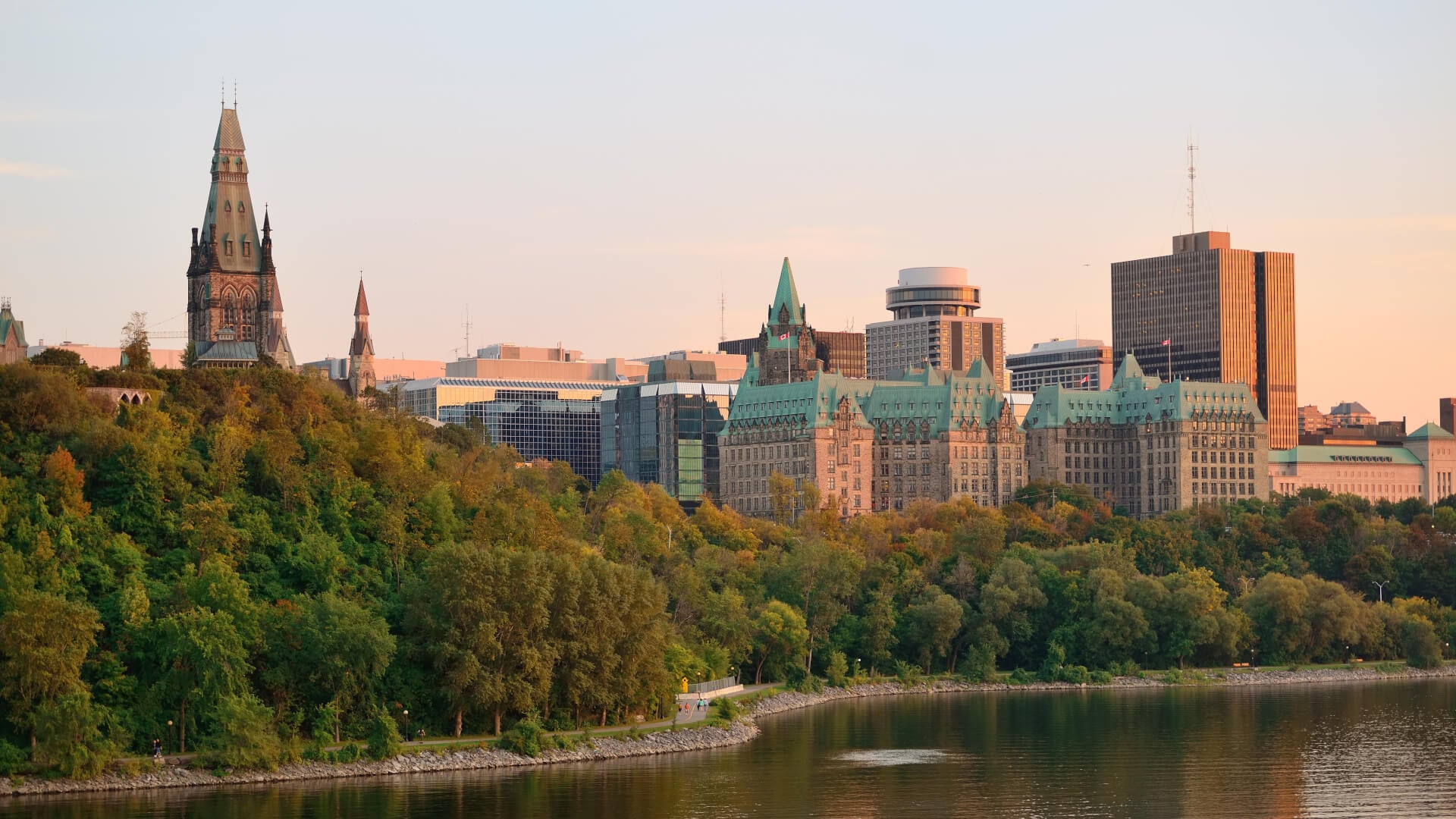 Ottawa sunset over river with historical architecture