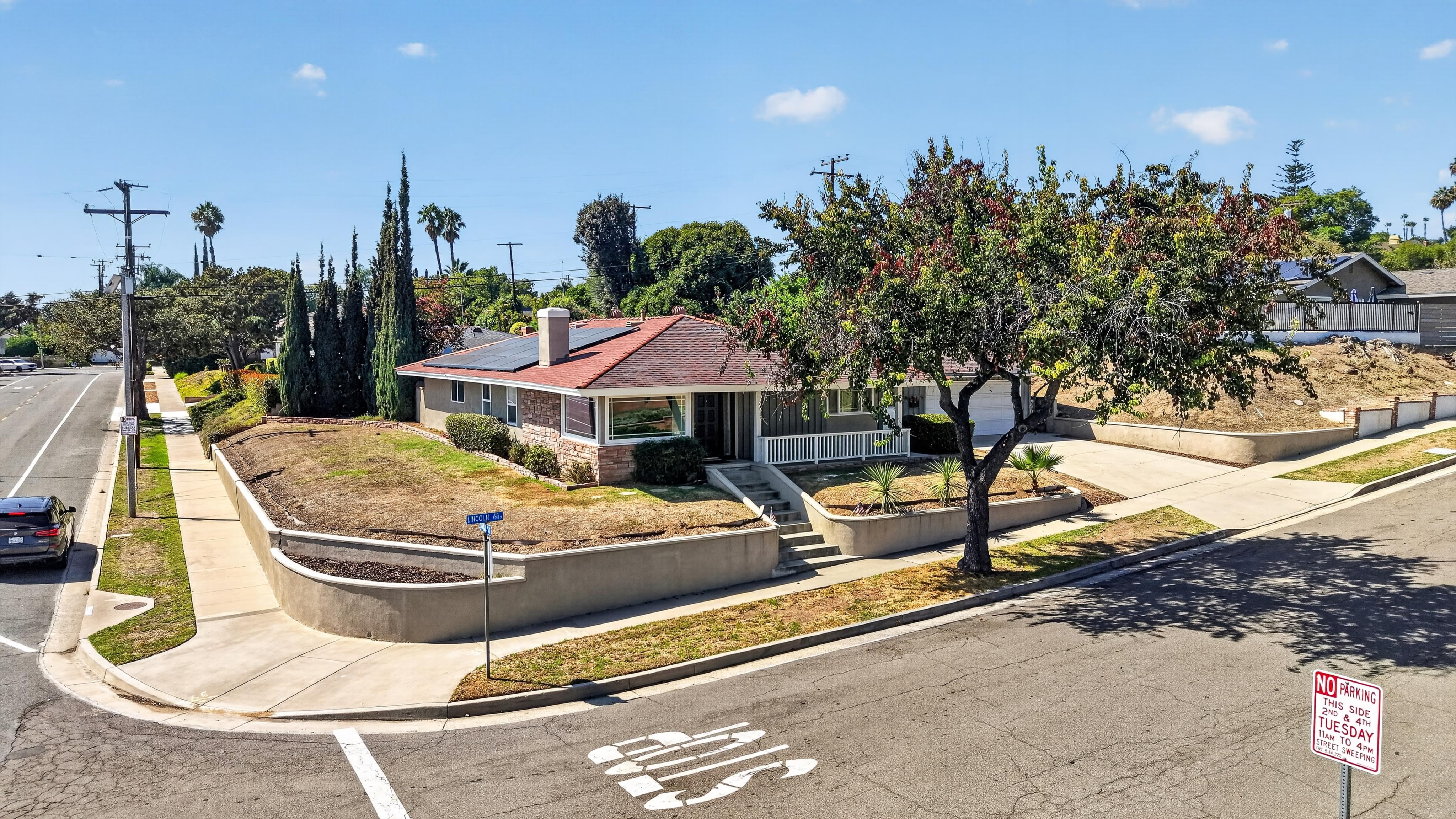 Professional daytime view of the single-story home and corner lot at 1201 N Lincoln Avenue in Fullerton.