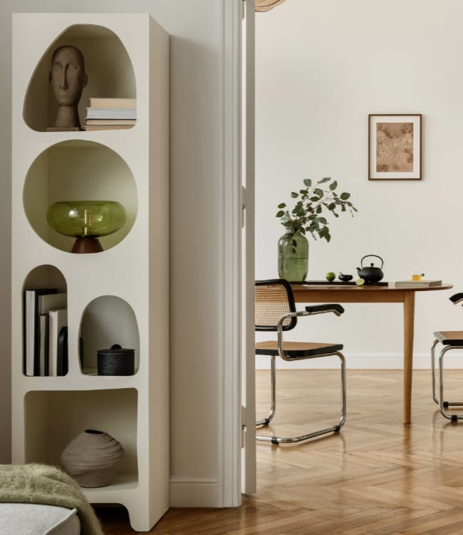 Minimalist dining room, modern chairs, wooden table, green vase with yellow flowers.(1)