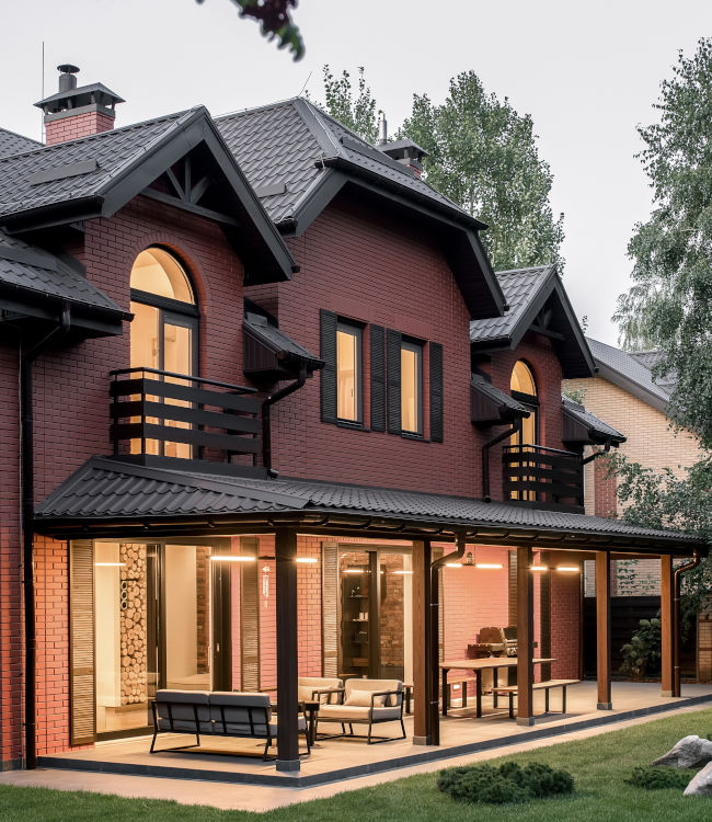 Illuminated,Modern,Two,Storey,Country,House,On,The,Sky,Background.