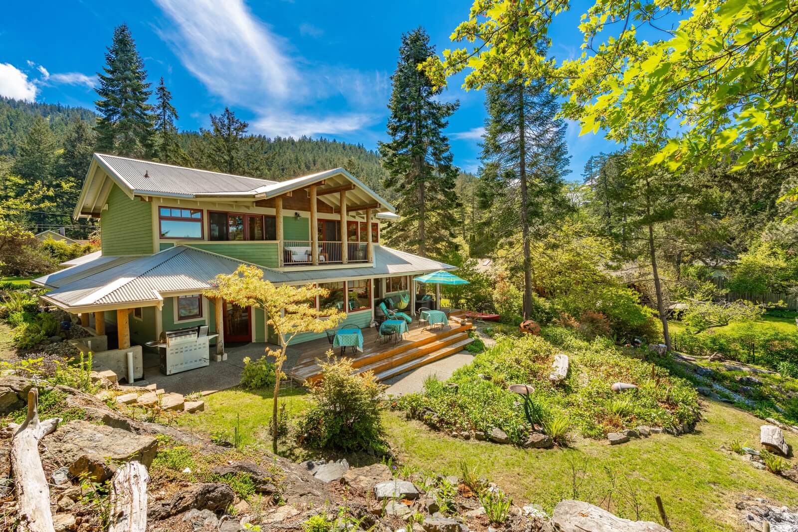 Sunrise Cove Lummi Island Washington beautiful beach house home exterior rocky landscape on a peaceful ocean