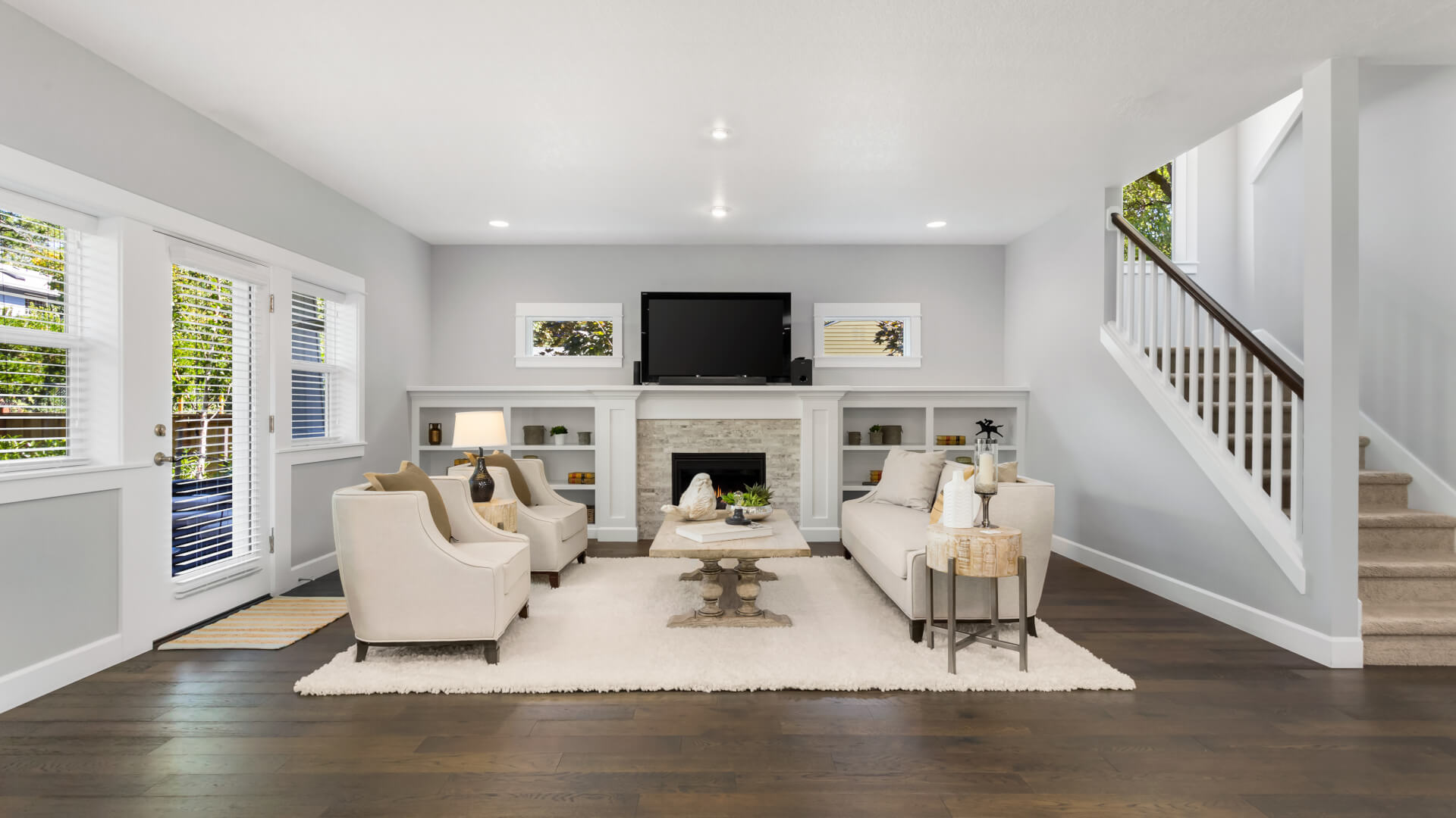 Beautiful living room in new traditional style home. Features fireplace, couch, coffee table