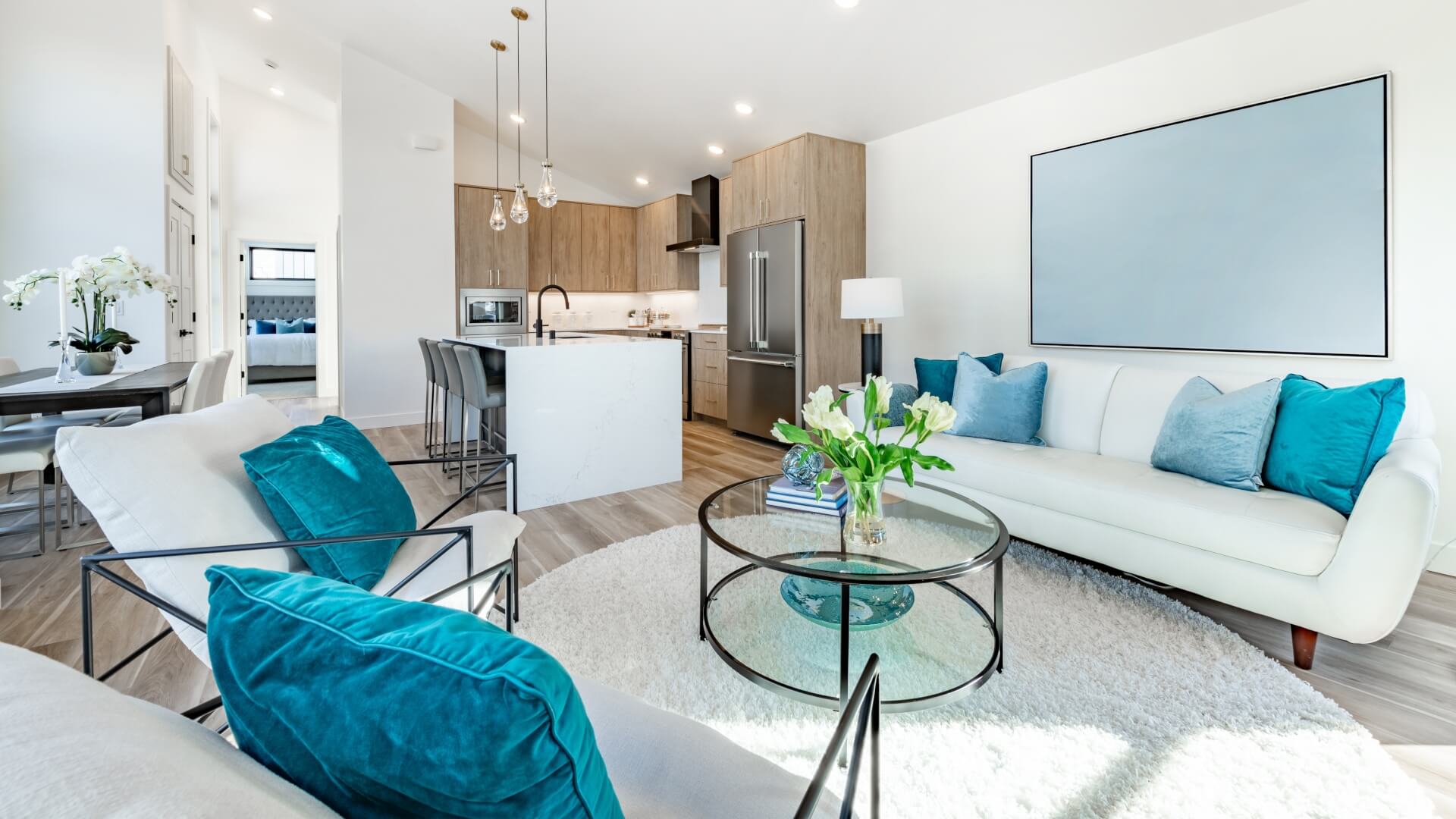 Home interior showing kitchen dining and living room decorated with blue color
