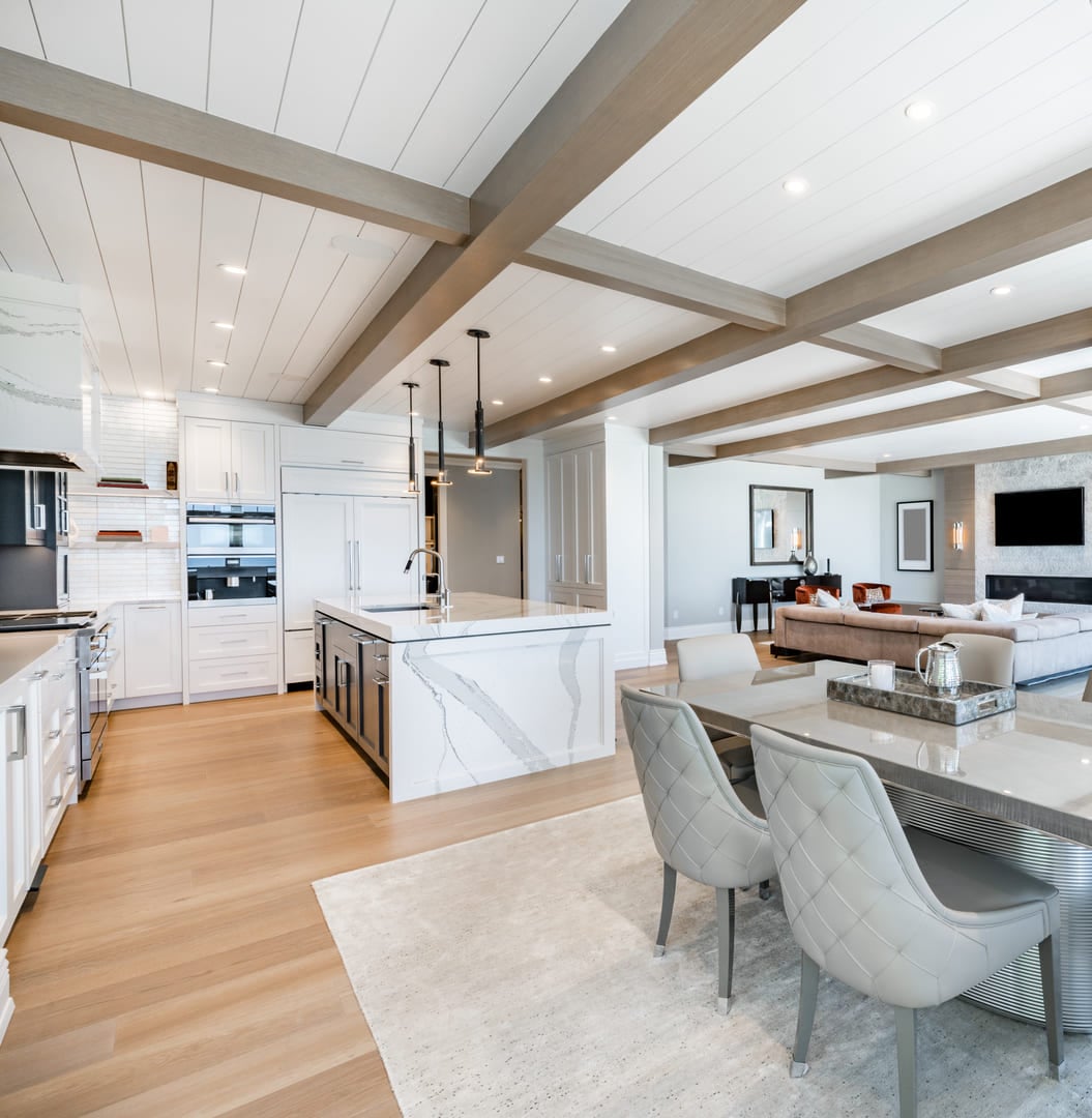 Luxurious high end kitchen with stainless appliances marble and glass tile