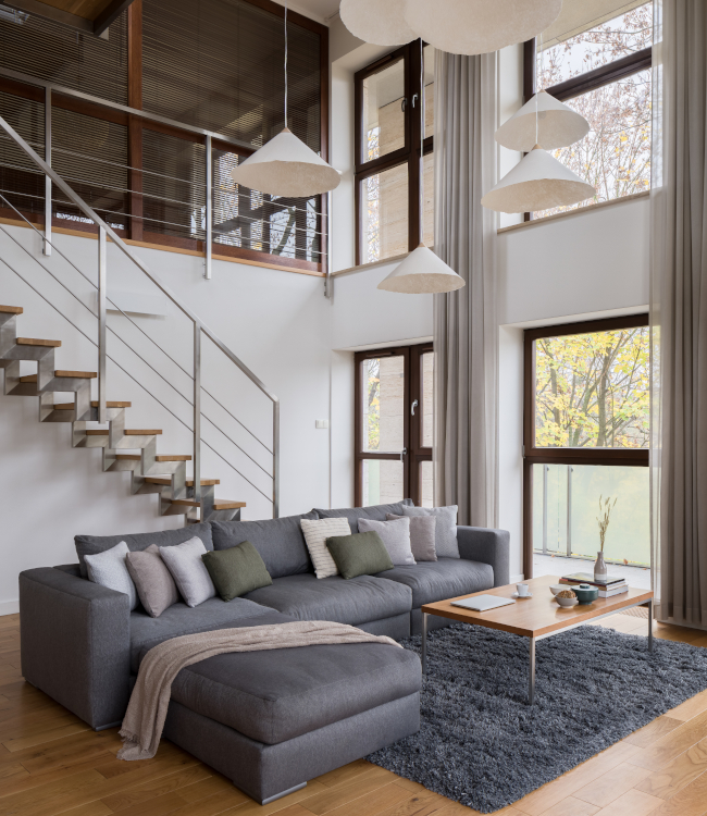 Stylish,Living,Room,With,Big,Sofa,,Many,Windows,And,Stairs