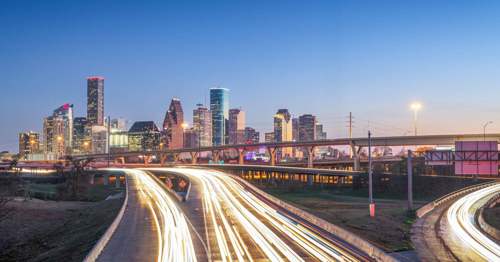 Houston, Texas, USA downtown skyline over the highways at dusk.