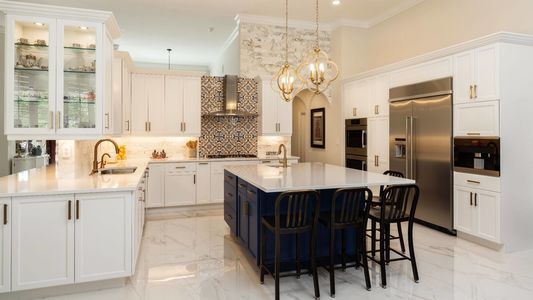 Beautiful luxury home kitchen with white cabinets.
