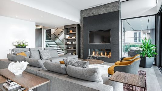 Luxurious and elegant living room with slate and dark yellow tones