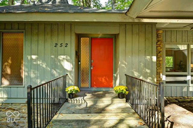 Wooden footbridge leading to the front door of the Woods House
