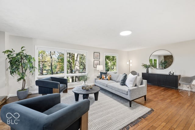 North-facing wall of glass in the Woods House living room looking into the treetops