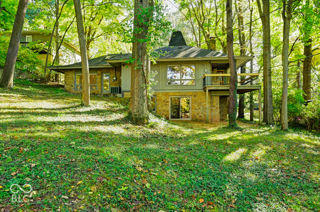 Rear of the Woods House from the backyard, showing the walk-out level set into the ravine