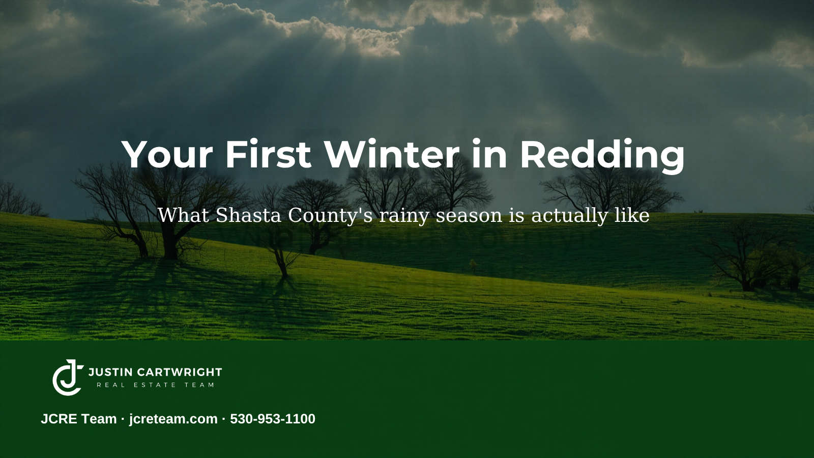 Sunlight breaking through winter storm clouds over green oak hills near Redding, California