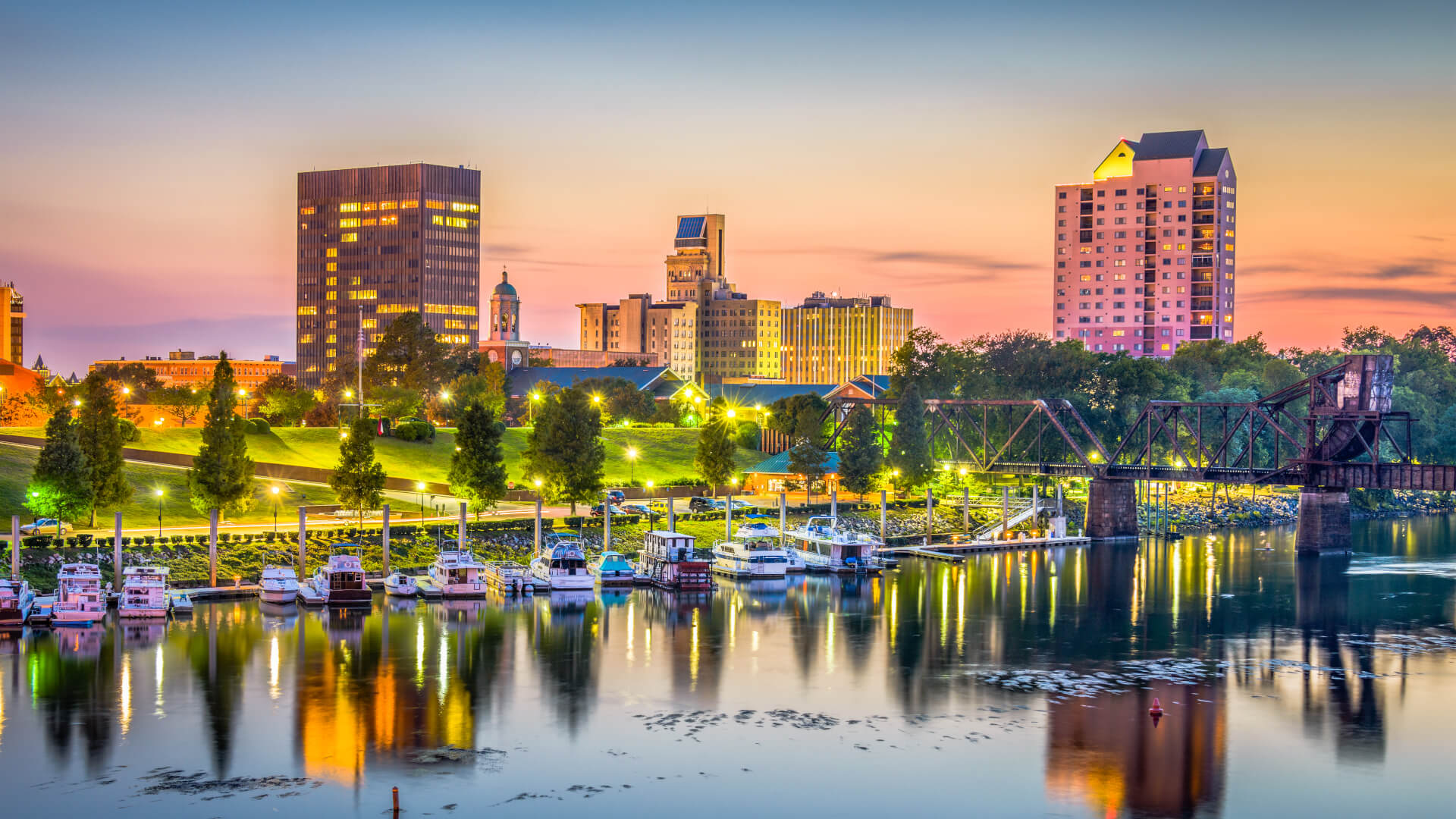 Augusta, Georgia, USA skyline on the Savannah River at dusk.