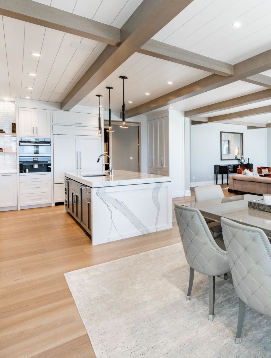 Luxurious high end kitchen with stainless appliances marble and glass tile