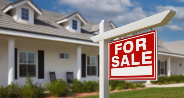 Home with For Sale Sign
