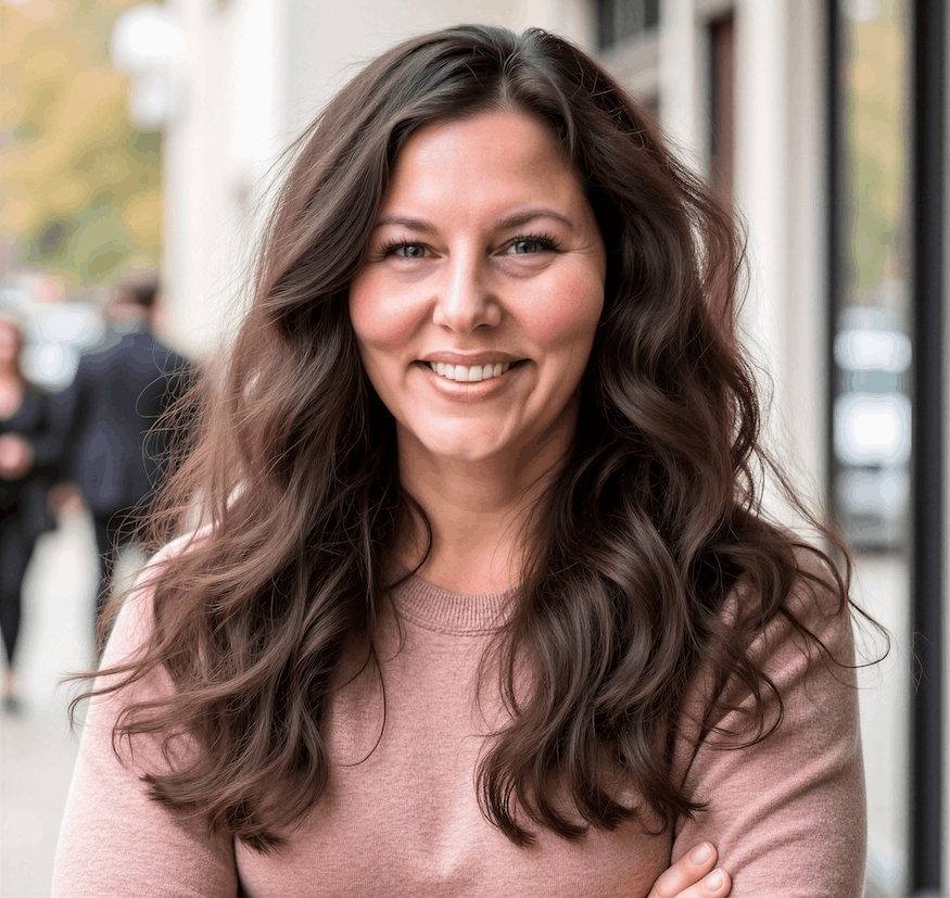 KoriHeadshotPinkSweaterSmile cropped