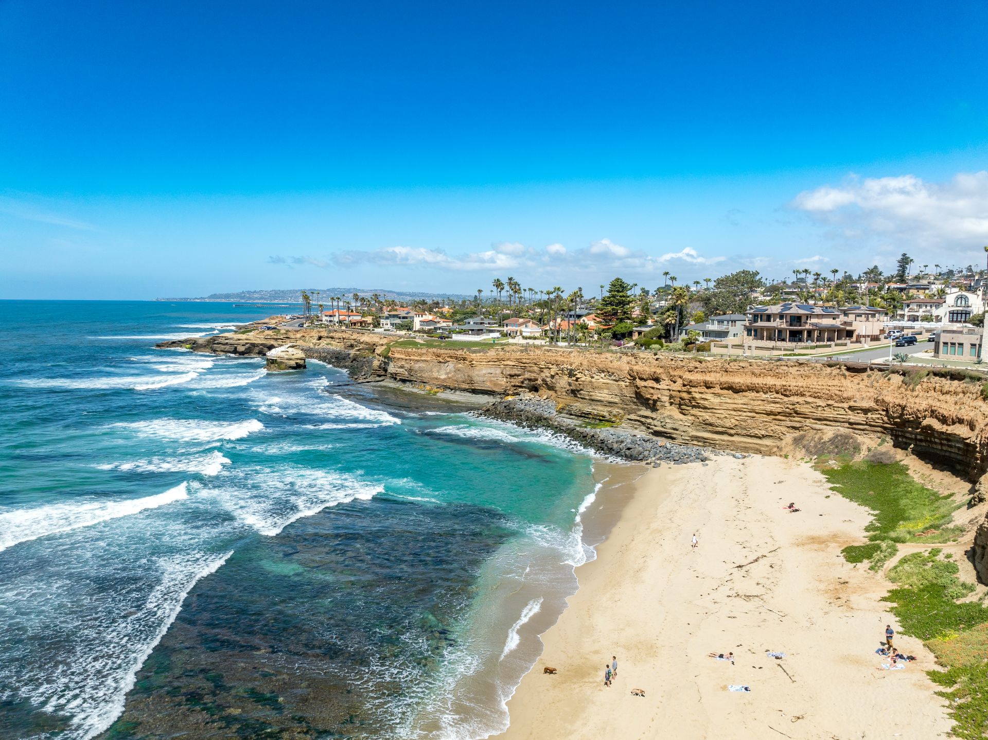 Aerial panorama of Sunset Beach in San Diego with ragged California ocean coastline, crushing waves (2)