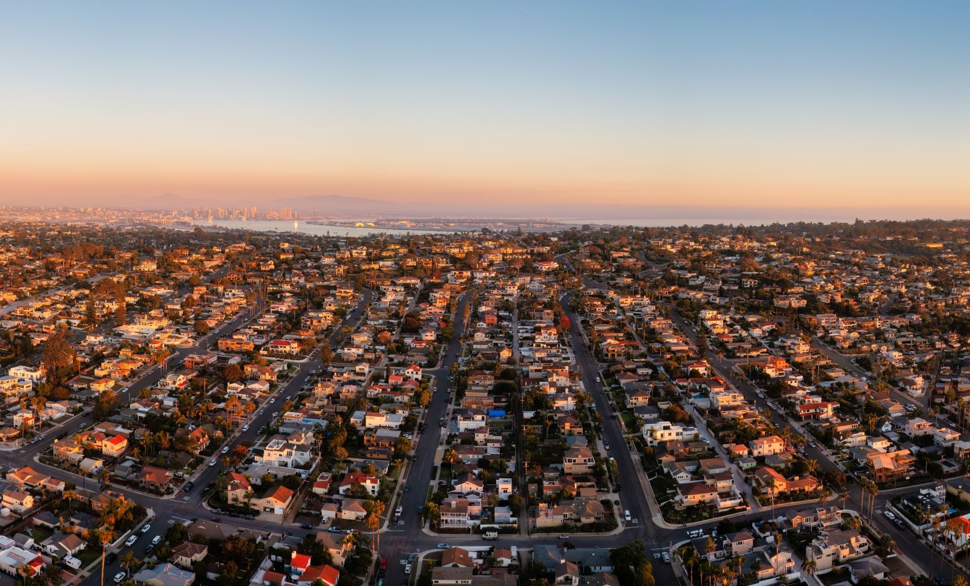 Homes in Point Loma near Sunset Cliffs. San Diego skyline in the distance. Drone photo.