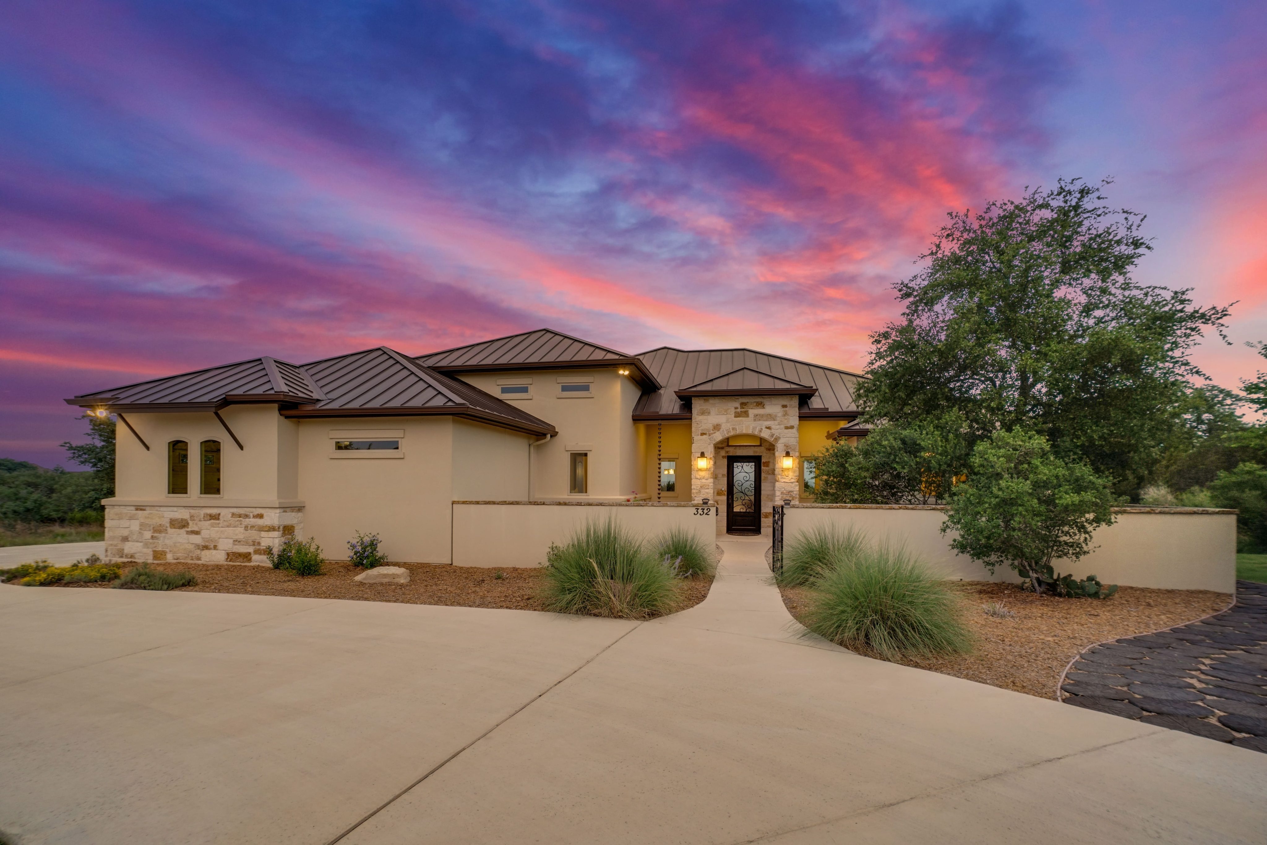 A beautiful luxury home at sunset-min