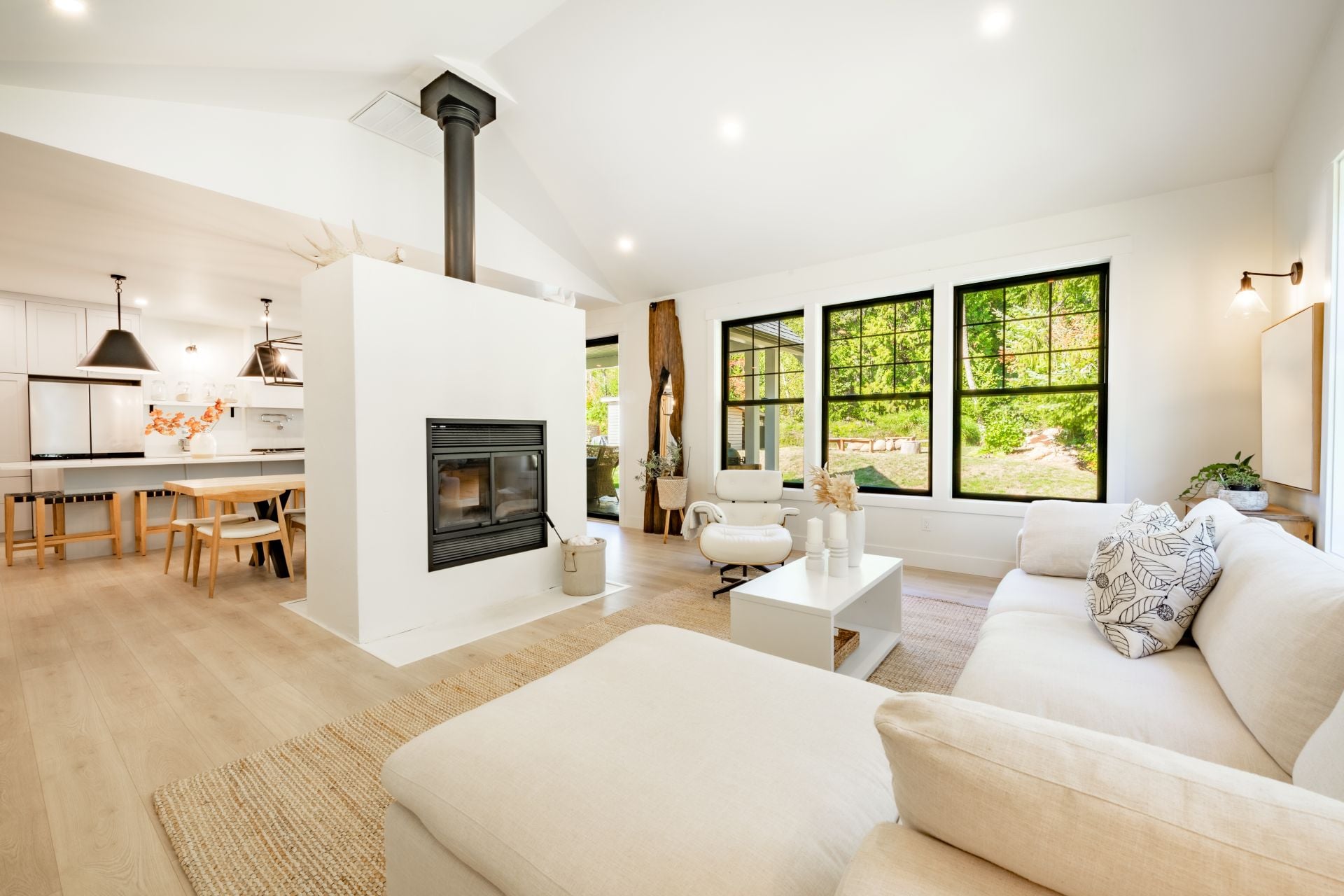 modern farmhouse living room with fireplace white furniture soft and airy appearance comfortable family home interior