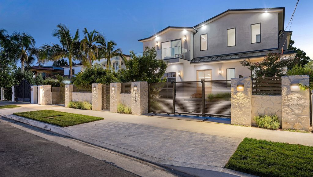 A house with a beautiful garden and metal gates. California, USA