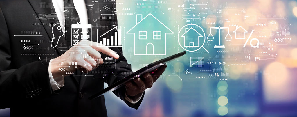 Investor reviewing real estate financial charts and housing data on digital tablet