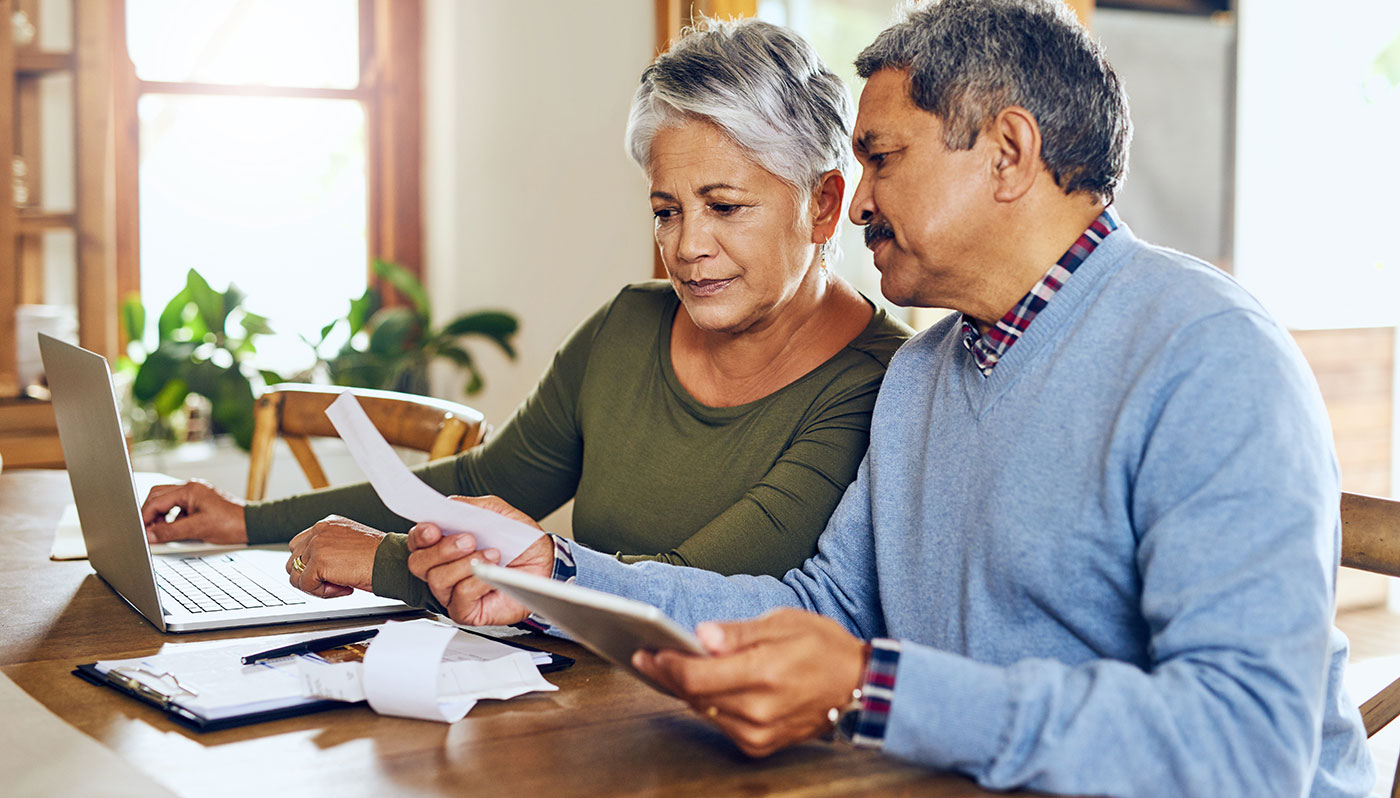 Old-Hispanic-Couple-Looking-at-their-Finances