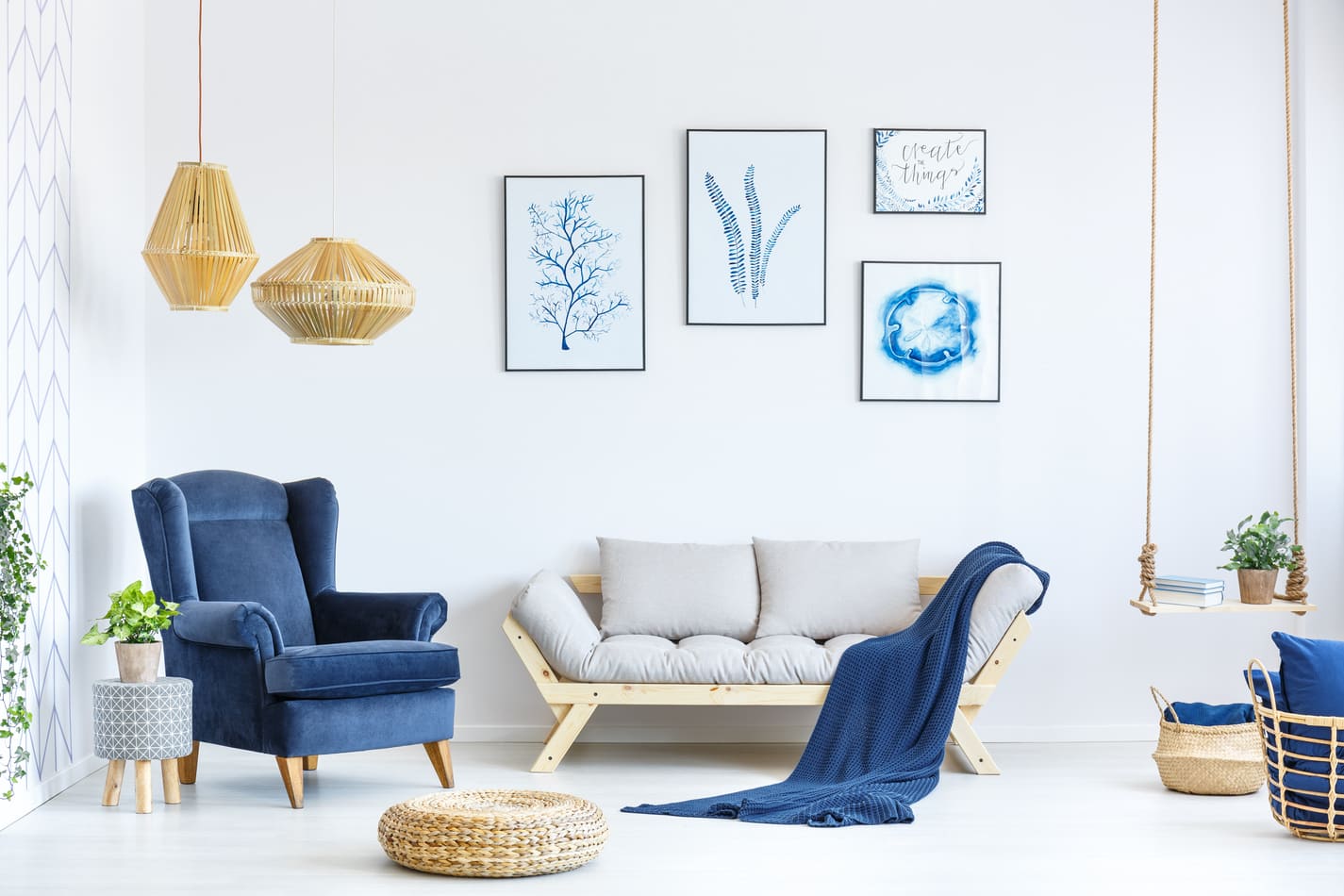 White and blue living room with sofa, armchair, lamp, posters (1)